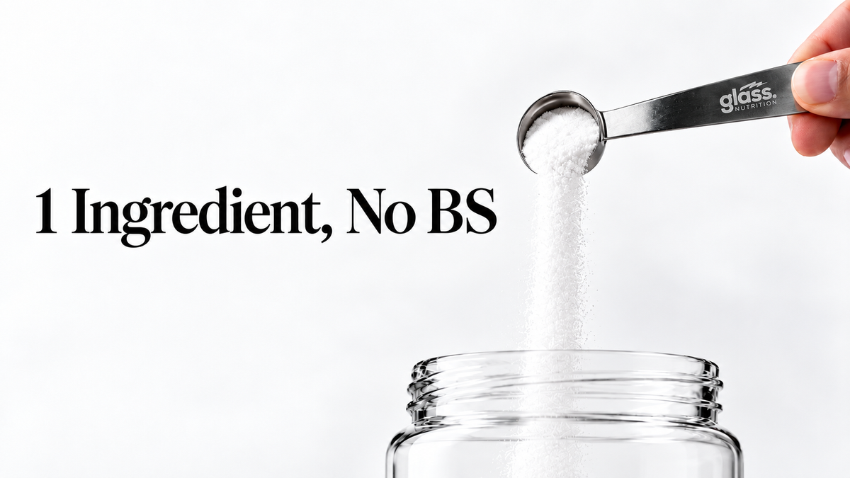 A Glass Nutrition stainless steel scooper pouring white creatine powder into a glass jar, next to the words 1 Ingredient, No BS